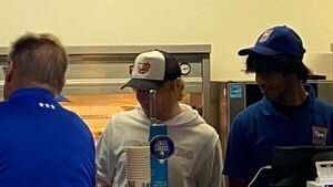 Ed Sheeran celebrates Ipswich Town win with players after pulling pints for fans