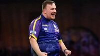 Luke Littler continues dream World Championship with victory over Andrew Gilding