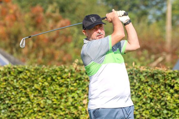 Derek Mannion keeps a eye on his approach shot to the green Derek Mannion keeps a eye on his approach shot to the green