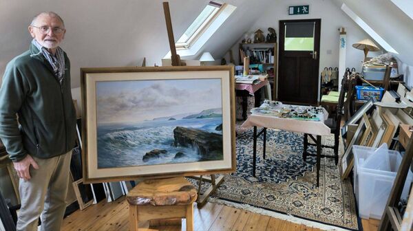 Tom Joyce pictured in his art studio in Glenbarrow with the main piece of his exhibition 