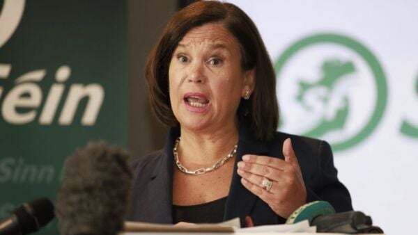 McDonald says loyalists behind 'traitor' posters at anti-immigration protests