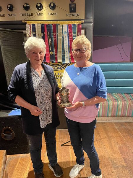 Mary White presenting the Geraldine O'Loughlin award to Mary Killeen 