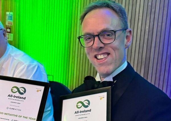 Ballykilcavan Brewing Company co-owner David Walsh-Kemmis displaying the most recent awards her won at the All-Ireland Sustainability Awards.