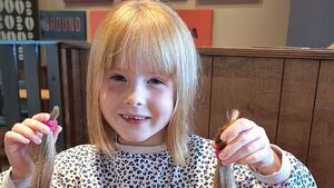 Laois schoolgirl cuts her hair for children's charity Laois schoolgirl cuts her hair for children's charity