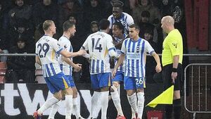 Ten-man Brighton survive anxious finish to edge out Bournemouth