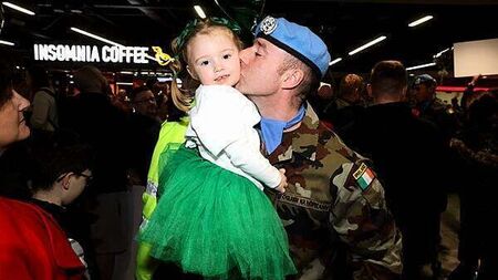 Cheers and emotional reunions as Irish peacekeepers touch down on home soil