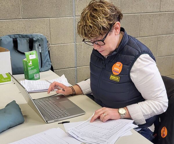 Independent election candidate Aisling Moran counting the early tally figures in the count centre in Portlaoise.