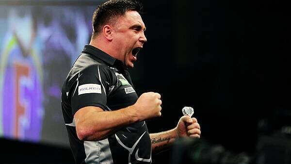 Gerwyn Price eases past Keane Barry to reach third round at Alexandra Palace