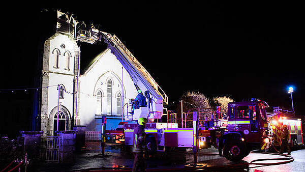Church spire collapses to ground in flames after lightning strike