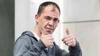 Man accused of harassment put shotgun cartridge in ex's hand saying 'you're next', court hears
