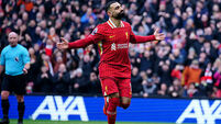 Liverpool survive late scare against Wolves to move seven points clear