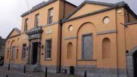 Woman charged with stealing €2 package of biscuits