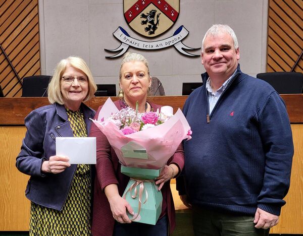 The cathaoirleach and leas cathaoirleach of Portlaoise Municipal District Council cllrs Paddy Buggy and Catherine Fitzgerald presenting a bouquet of flowers and small gift to Michelle McCormack on her final day as administrative officer to councillors.