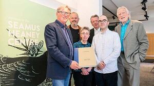 Adrian Dunbar gives rare art book to the Seamus Heaney Centre
