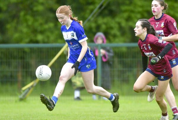 Laois's Lucy Whelan solos away from these Westmeath players Photo: Denis Byrne