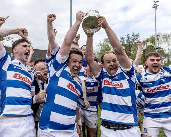 Athy captain Tadgh Foley and Craig Miller raise the Provincial Towns Cup