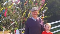 Two generations keep up with tradition and decorate Laois May bush 