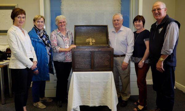 Photographed beside the Mountmellick Famine Orphan Box in Mountmellick Museum were (l-r): Ann Dowling and Anne Sands (Mountmellick Museum), Lou Walsh (great-great granddaughter of Mary Millar), Ger Lynch and Dolores Dempsey (Mountmellick Museum) and Kev Walsh.