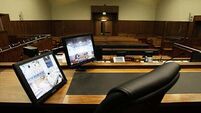 Woman (48) weeps in court as she admits killing her partner