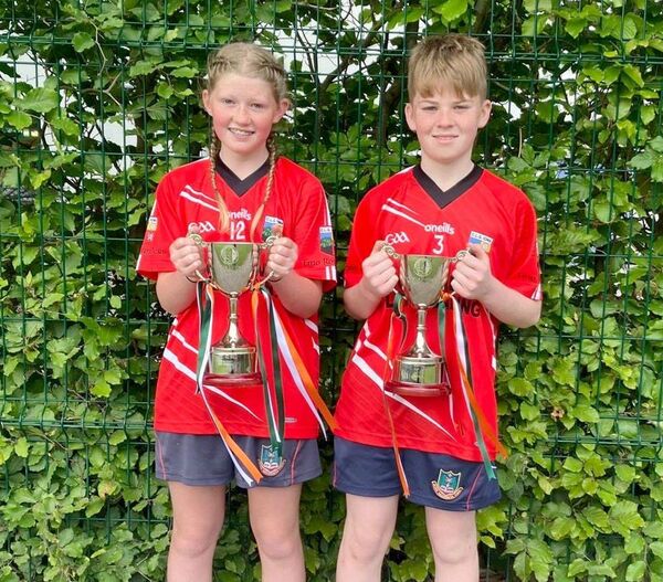 The winning captains, Laura Meredith and Tommy Murphy with the All-Ireland trophies The winning captains, Laura Meredith and Tommy Murphy with the All-Ireland trophies
