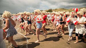 Almost 200 Marilyn Monroe lookalikes take the plunge for charity swim