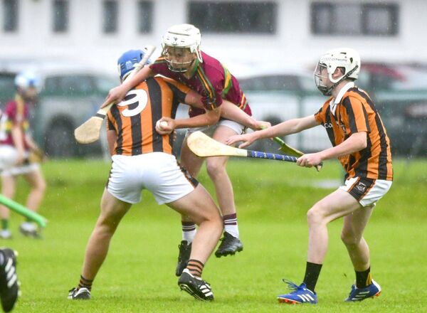 Charlie Pevoy (Camross) halts Jake Keating Ballinakill Ballypickas) in his tracks Photo: Denis Byrne Charlie Pevoy (Camross) halts Jake Keating Ballinakill Ballypickas) in his tracks Photo: Denis Byrne