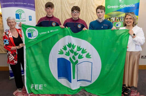 Heywood CS students Ryan Brennan, Harry Connolly and David Kelly and teacher Ms Ruttle with Karen Moore (Community Climate Action Officer with Laois County Council) at the Green Schools awards Picture: Alf Harvey.