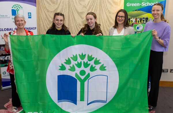 Camross NS pupils Millie Cuddy and Saoirse Gaughan; SNA Ms Fiona Cuddy and teacher Ms Phillis Petereit with Karen Moore (Community Climate Action Officer with Laois County Council) at the Green Schools awards Picture: Alf Harvey.