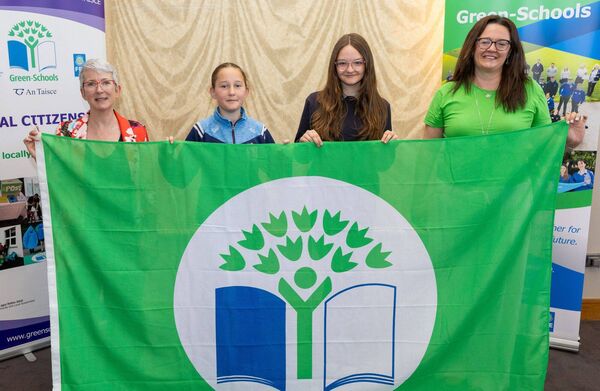 Shanganamore NS (Barrowhouse) pupils Alice Gleeson and Arwyn Kendellen and parent Aoife Kendellen with Karen Moore (Community Climate Action Officer with Laois County Council) at the Green Schools awards in Kilkenny. Picture: Alf Harvey.