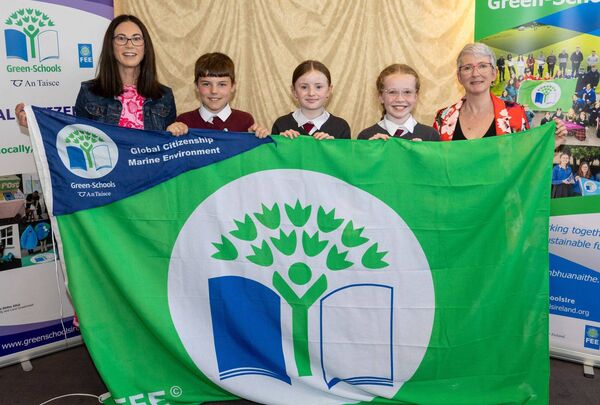 Killeshin NS pupils Mikey Collins, Ellie Nolan and Freya Whelan and teacher Ms Clair Keating with Karen Moore (Community Climate Action Officer with Laois County Council) at the Green Schools awards Picture: Alf Harvey.