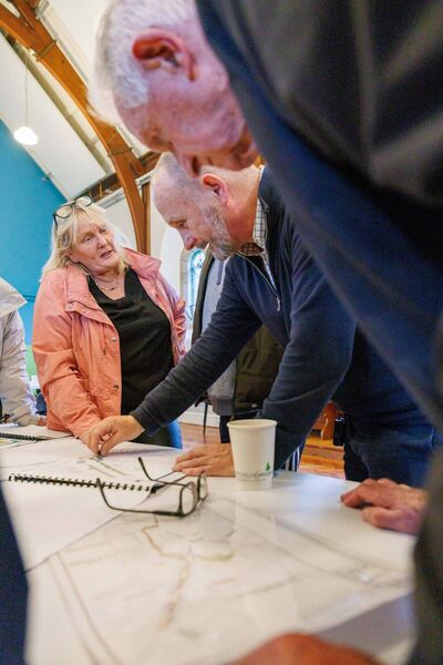 Members of the public discussing plans at the public Information evening on proposed enhancement works to Patrick Street and the River Walk in Mountrath held by Laois County Council at Bloom HQ. Picture: Jeff Harvey