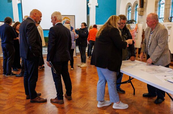 Members of the public discussing plans at the public Information evening on proposed enhancement works to Patrick Street and the River Walk in Mountrath held by Laois County Council at Bloom HQ. Picture: Jeff Harvey