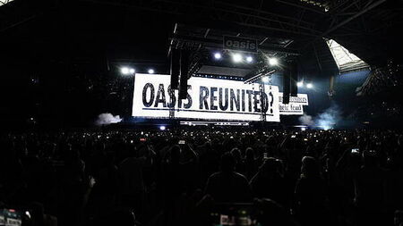 Oasis take to stage for first gig in 16 years to jumping crowd and flying cups