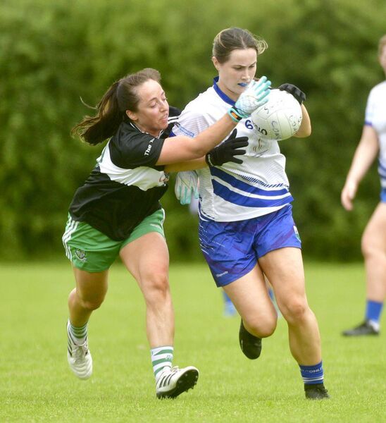 Aisling Saunders (Portlaoise) putting pressure on St Conleth's Alice Kearns Photo: Denis Byrne