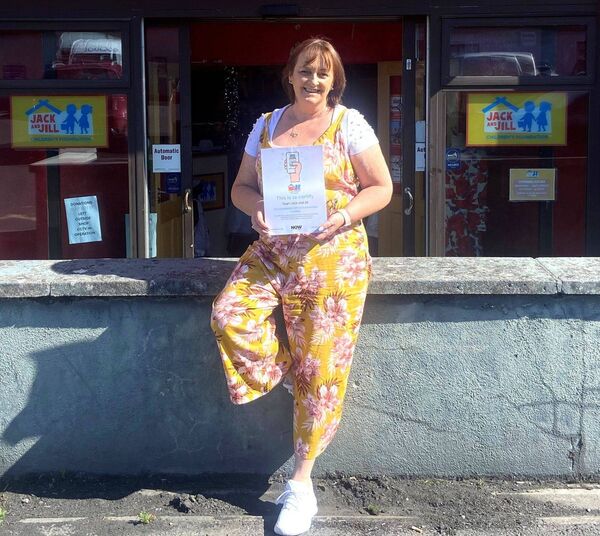 Manager of the Jack and Jill Charity Boutique in Portlaoise Martina Cooper displaying the JAM sign depicting the store's inclusivity. Manager of the Jack and Jill Charity Boutique in Portlaoise Martina Cooper displaying the JAM sign depicting the store's inclusivity.
