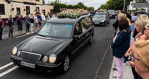 Murdered mother and children ‘together and finally safe’ – funeral hears
