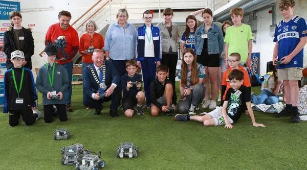Cathaoirleach of Laois County Council cllr Barry Walsh is pictured alongside the council’s arts officer Muireann Ni Chonaill, the Laois Outdoor Education Officer Edel Herren and the Laois STEAM engagement Officer Seanie Morris watching the participants of the four-day summer camp take control of their homemade robots. Photo: Michael Scully Cathaoirleach of Laois County Council cllr Barry Walsh is pictured alongside the council’s arts officer Muireann Ni Chonaill, the Laois Outdoor Education Officer Edel Herren and the Laois STEAM engagement Officer Seanie Morris watching the participants of the four-day summer camp take control of their homemade robots. Photo: Michael Scully