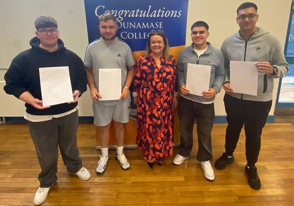 ‘The lads’ from Dunamase College/Coláiste Dhún Másc pose for a photograph with the college principal Dympna Kelly after they received the results of their leaving cert exams ‘The lads’ from Dunamase College/Coláiste Dhún Másc pose for a photograph with the college principal Dympna Kelly after they received the results of their leaving cert exams