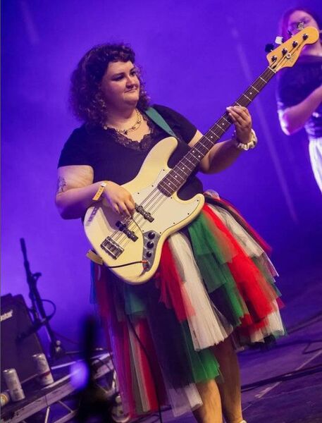 Róisín Barrett pictured on stage playing with The Mary Wallopers in her own designed Palestine coloured skirt, at the sold-out gig in Fairview Park in Dublin in June. Róisín Barrett pictured on stage playing with The Mary Wallopers in her own designed Palestine coloured skirt, at the sold-out gig in Fairview Park in Dublin in June.