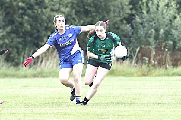 Ballyfin's Chloe Scanlon tries to shake off the attention of St Paul's Kelly Hogan Photo: David Maher Ballyfin's Chloe Scanlon tries to shake off the attention of St Paul's Kelly Hogan Photo: David Maher