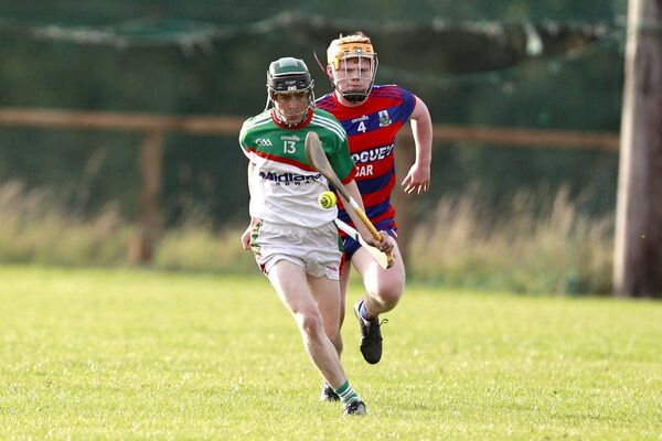 Jack Dowling breaks for Rathdowney/Errill with Colt-Shanahoe's Mark Hearns giving chase in their PIHC quarter-final Photo: David Maher 