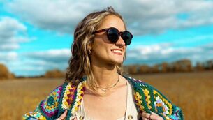 <p>Mountmellick crochet artist Courtney Murray models one of her colourful designs. Photo: Instagram</p>
