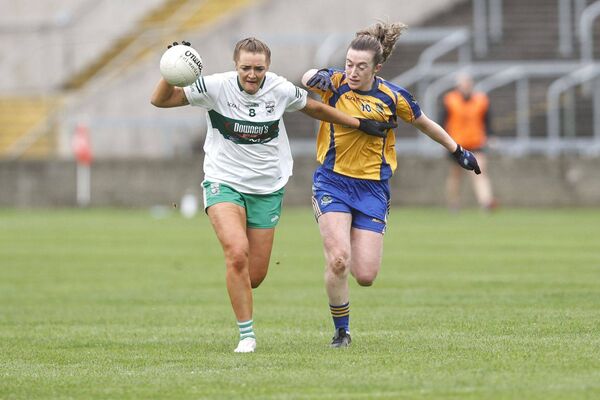 Portlaoise's Fiona Dooley holds off Sarsfields' Laura Marie Maher Photo: David Maher Portlaoise's Fiona Dooley holds off Sarsfields' Laura Marie Maher Photo: David Maher