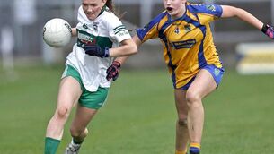 <p>Portlaoise's Susie Delaney drives away from Sarsfields' Sarah Hibbits in their LOETB LGFS senior championship semi-final at Laois Hire O'Moore Park on Saturday Photo: David Maher</p>
