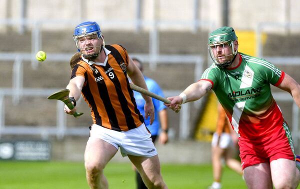 Far reaching - Liam Delaney (Camross) stretches for this sliotar with Neil Foyle (Borris/Kilcotton) moving to challenge in theit Senior Hurling Championship quarter-final at Laois Hire O'Moore Park on Sunday Photo: Denis Byrne