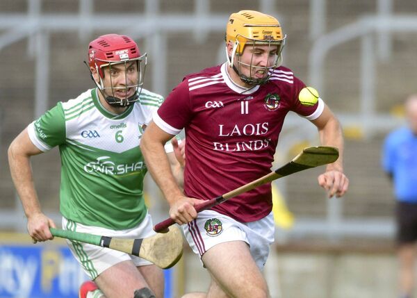 Ballinakill's Seamus Fitzpatrick drives at the heart of the Rosenallis defence in their Senior Hurling Championship quarter-final win at Laois Hire O'Moore Park on Sunday Photo: Denis Byrne