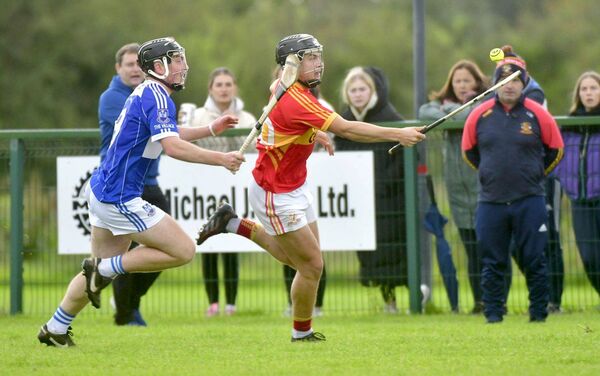 Catch me if you can - Eoghan Murphy (The Harps) breaking with Loughlin Hegarty (Castletown) giving chase Photo: Denis Byrne Catch me if you can - Eoghan Murphy (The Harps) breaking with Loughlin Hegarty (Castletown) giving chase Photo: Denis Byrne