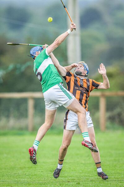 Ballyfin's James Finn and Camross' Craig Carroll battle for possession Photo: Paul Dargan