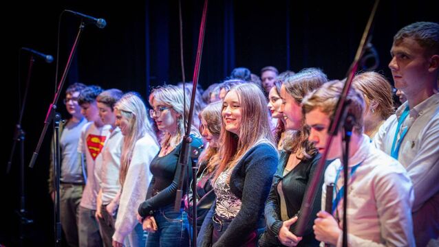 <p>Performing the group song </p>