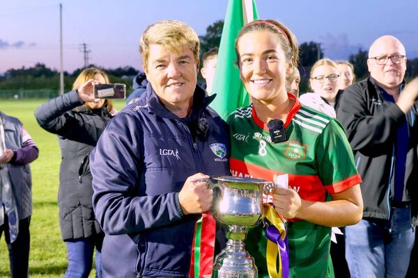 Martina Phelan, Chairperson Laois LGFA present Graiguecullen's Caoimhe Fitzpatrick with the Intermediate championship trophy Photo: Paul Dargan Martina Phelan, Chairperson Laois LGFA present Graiguecullen's Caoimhe Fitzpatrick with the Intermediate championship trophy Photo: Paul Dargan